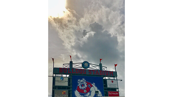Sun Breaking through Clouds at Bulldog Stadium by Traci Obata (Undergraduate Admissions)