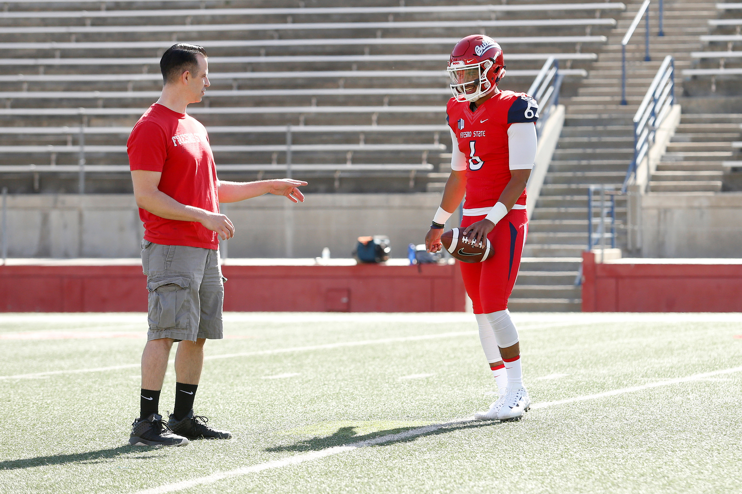 Cary working with former Fresno State quarterback Marcus McMaryion.