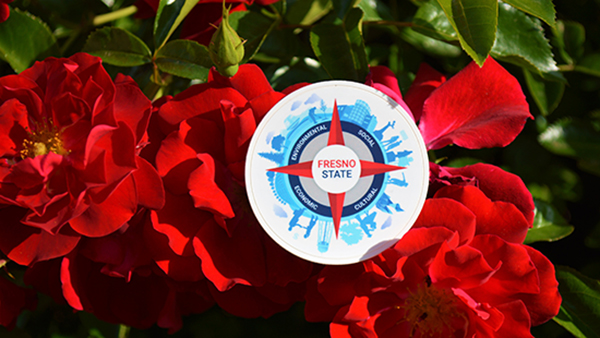 Red flowers with a button that says Fresno State