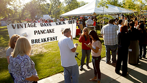 Employees waiting in line at Vintage Days kick off pancake breakfast
