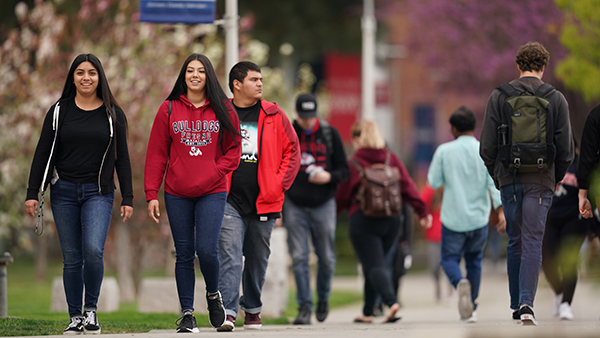 Students walking through the Fresno State campus.