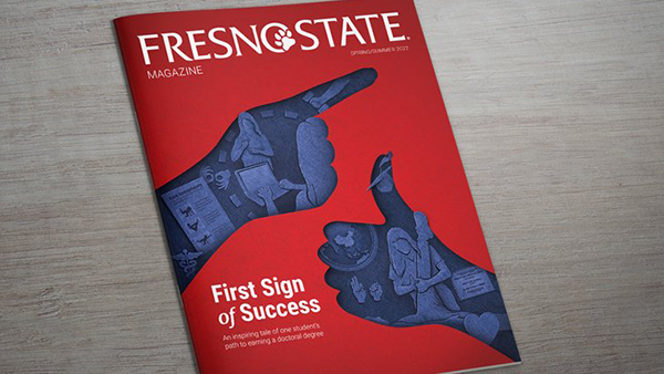 Cover of the Fresno State Magazine featuring two blue hands signing. Title: First Sign of Success.