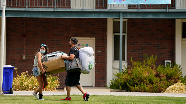 Student moving into Cedar Hall at Fresno State.
