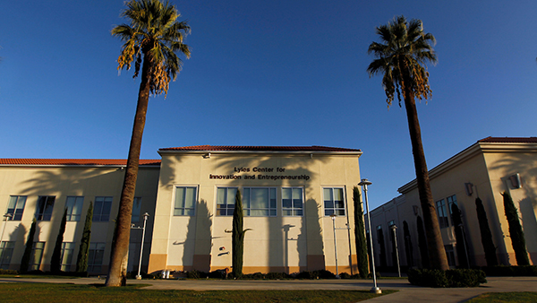 Lyles Center for Innovation and Entrepreneurship building flanked by two palm trees
