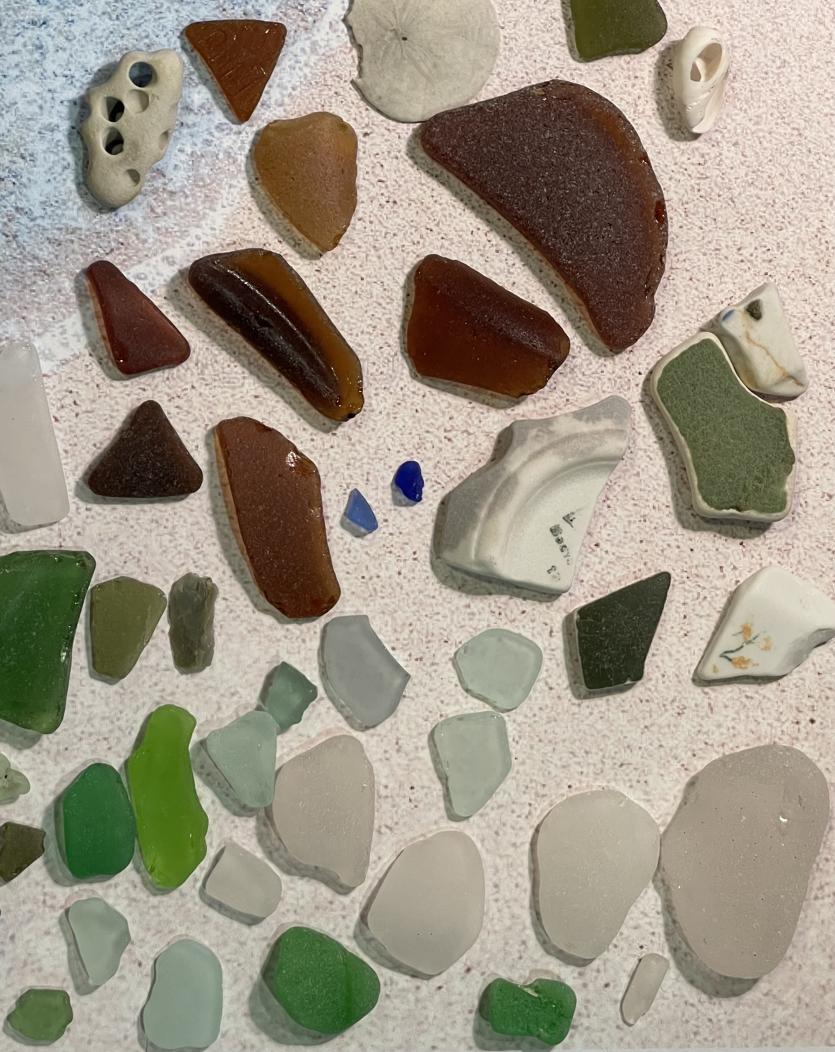 Brown, white and green pieces of sea glass.