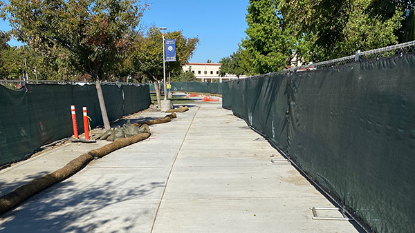 university high school sidewalk under construction