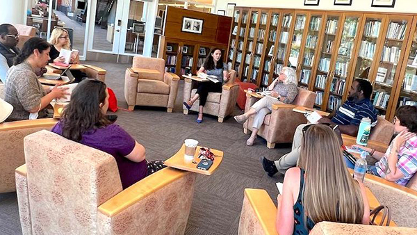 The Book Circle discussing a book in Reading Room.