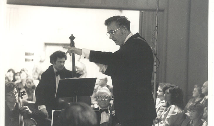 Dr. Arthur Huff conducting