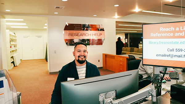 Arantes Armendariz at research services desk