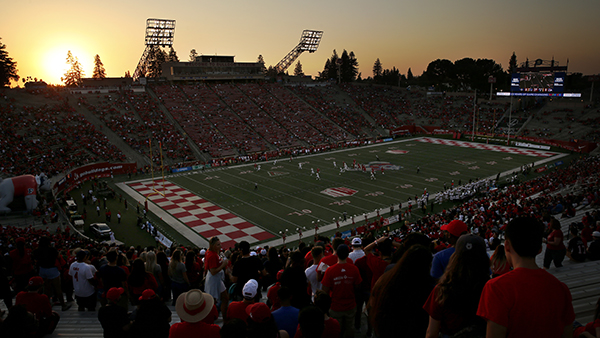 Sunset over Valley Children's Stadium during a football game.