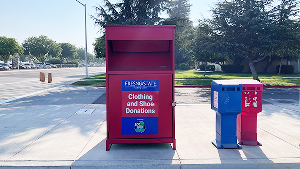 A new red donation bin for the Fresno State Clothing Closet.