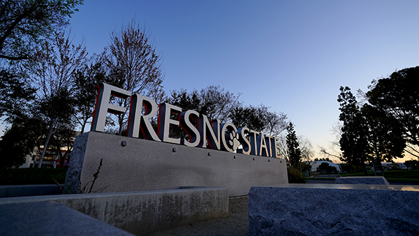Evening photo of the Fresno State sign.