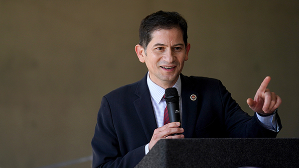 President Saúl Jiménez-Sandoval talking at a podium