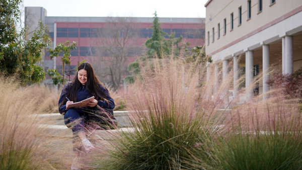 Girl sitting in front of Kremen building