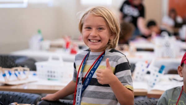 Boy giving a thumbs up