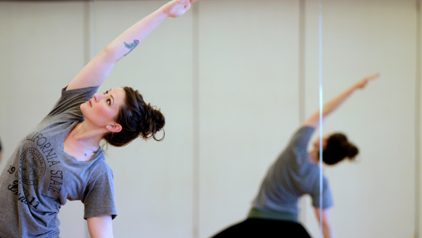 Woman stretching in mirror