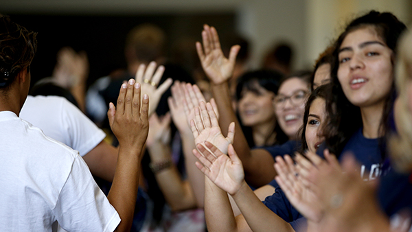 People giving high fives.