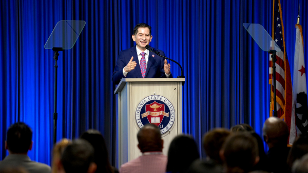 President Saúl Jiménez-Sandoval speaks at a podium during the Fall 2024 Faculty and Staff Assembly at the Resnick Student Union Ruiz ballroom.