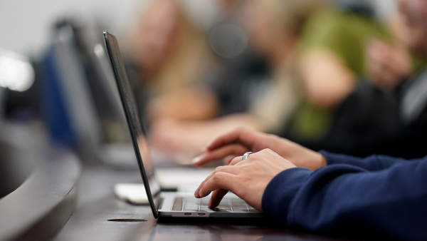 Person typing on laptop