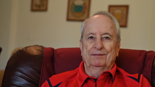 Portrait of Dr. Rosco Vaughn sitting in a chair.