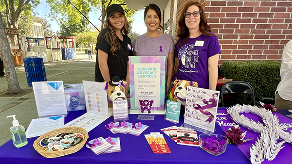 Employees tabling for Purple Thursday