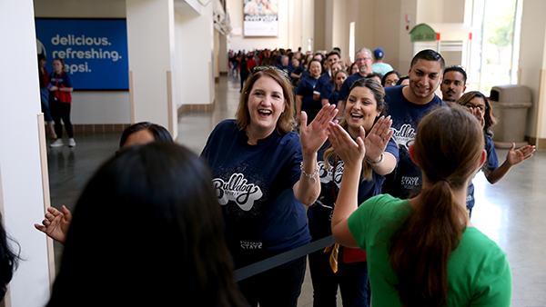 Staff high fives.