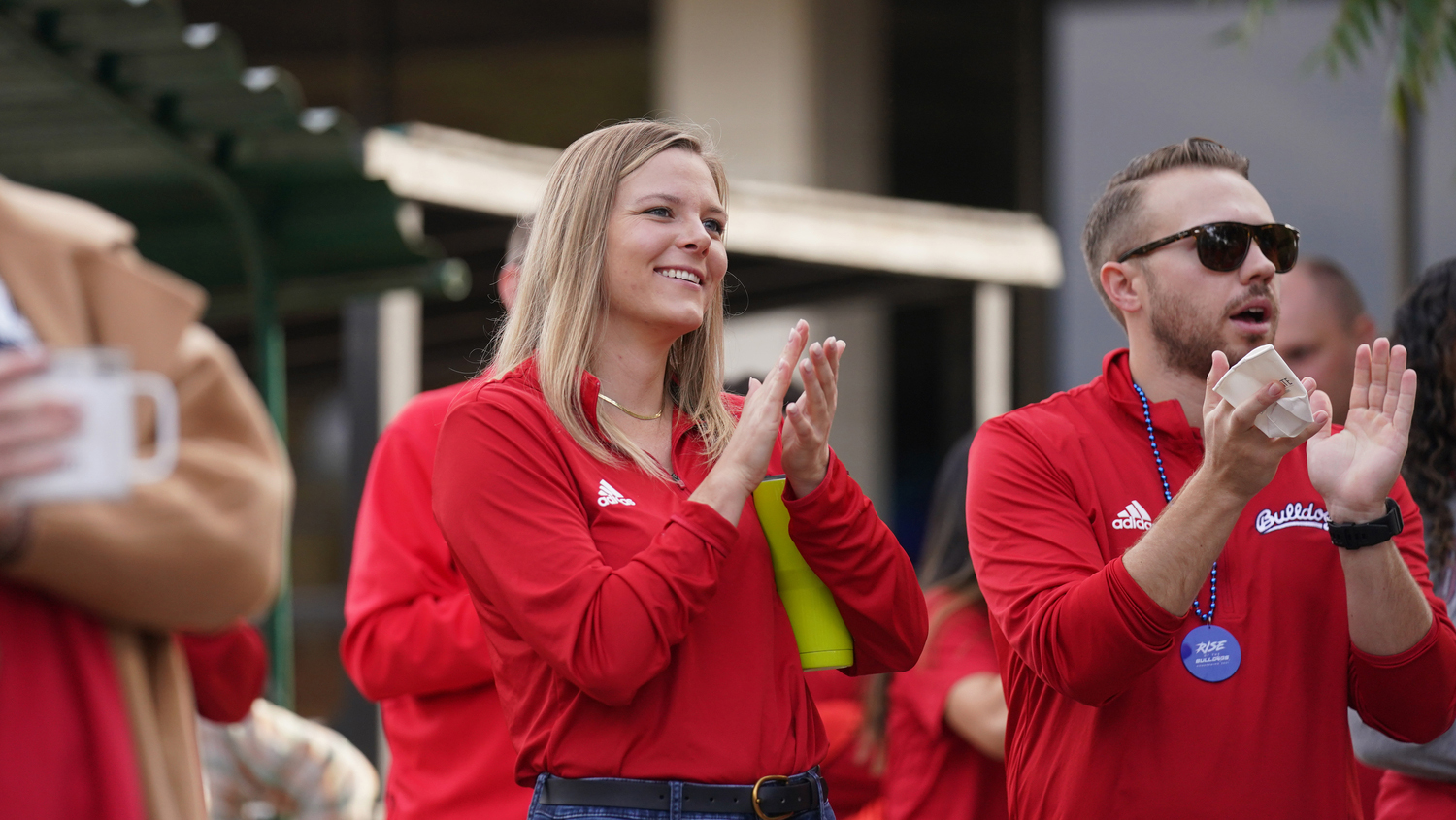 Fresno State staff clapping.