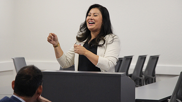 Yuliana Franco, a Fresno State alumna and finance professional, speaks at a GAL event.