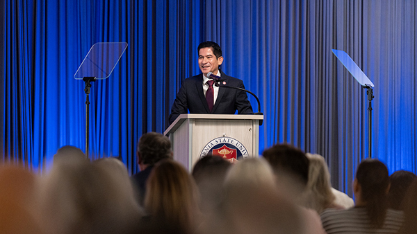 Saúl Jiménez-Sandoval at a podium addressing audience
