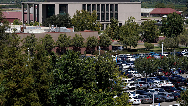 Parking lot with buildings in the background