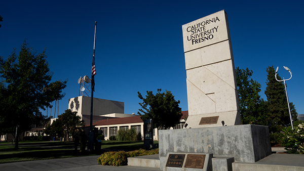 California State University, Fresno monument by the flag pole.