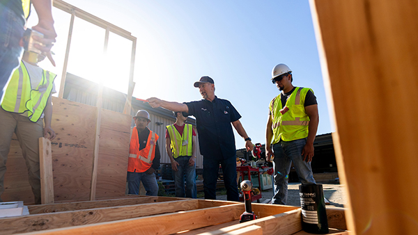 Construction professor sharing something with his students