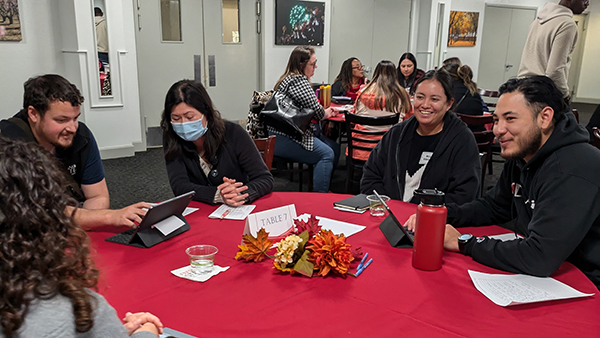 Employees sitting at Admin Academy event