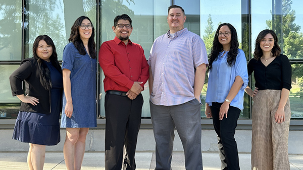 Advising team for the College of Social Sciences at Fresno State in front of the library