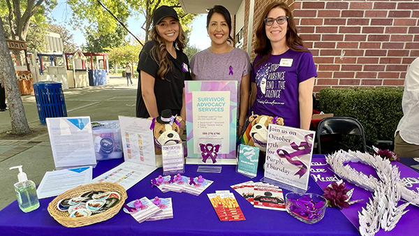 Students tabling for Survivor Advocacy Services on Fresno State campus.