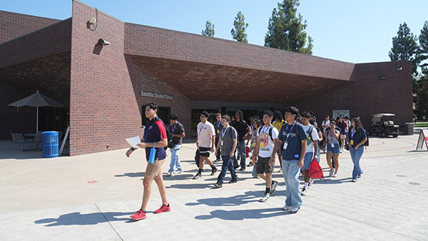 Students walking in front of the Satellite Student Union.