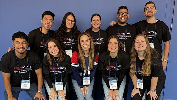 Dr. Jenelle Gilbert, chair and professor, Department of Kinesiology, in the center with students