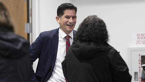 President Saul Jimenez Sandoval with employee at staff appreciation lunch