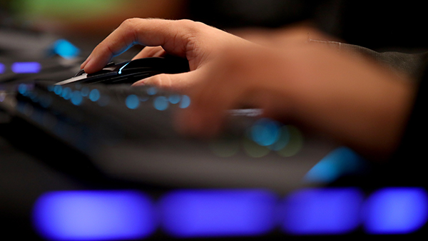 Student using keyboard and mouse