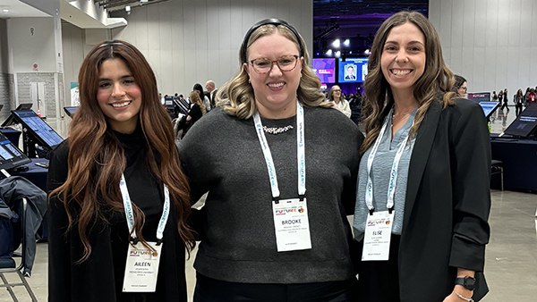 Graduate student Aileen Soria, Dr. Brooke Findley, associate professor, Department of Communicative Sciences and Deaf Studies, Elise Guerra, a Spring 2025 graduate and President’s Medalist pose for a photo.