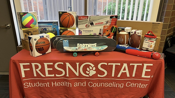 Balls and skateboards on a table for Fresno State Student Health and Counseling Center.