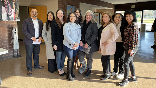 Mayra Aceves and colleagues pose for a photo.