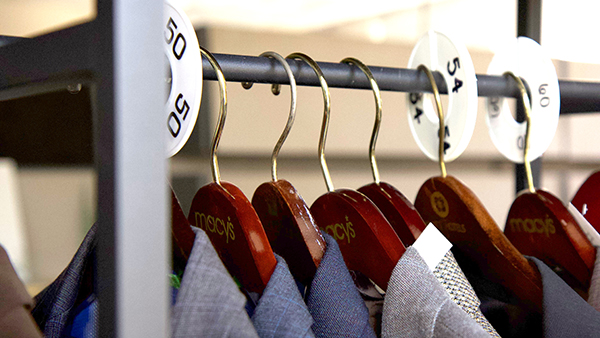 Suits hanging from rack in Career Development Center.