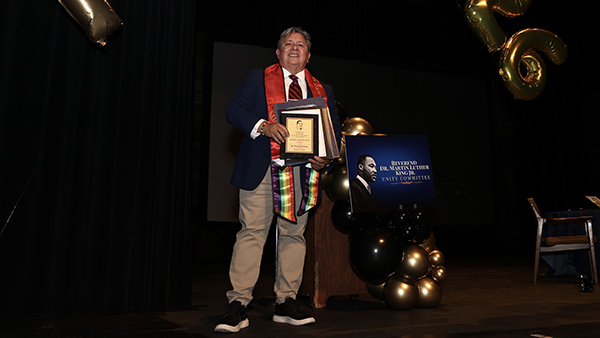 Dr. Peter Robertson holding MLK change maker award