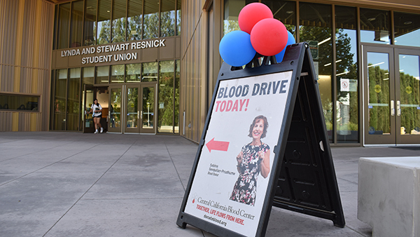 Fresno State Blood Drive sign in front of the Resnick Student Union