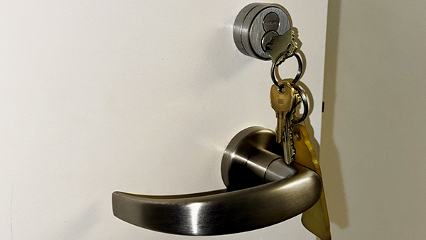 Keys unlocking a door