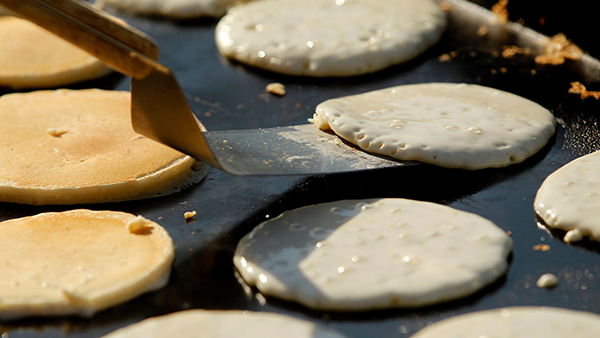 pancakes being made on a griddle