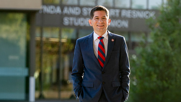 President Saul Jimenez Sandoval in front of the Resnick Student Union