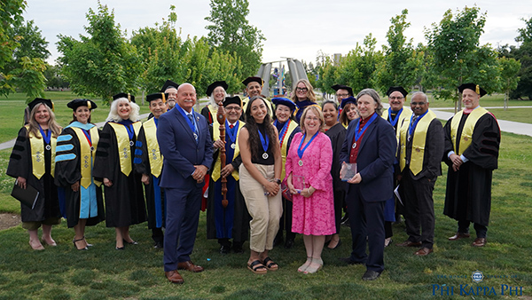 Members of Phi Kappa Phi with Fresno Mayor Jerry Dyer, front left, Dr. Amber Crowell, Kathy Yarmo and Vice Provost Dr. Alam Hasson.