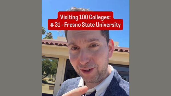 Duke professor Aaron Dinin points his finger at the screen during a video where he visits Fresno State. Words say visiting 100 colleges: #31 Fresno State University.